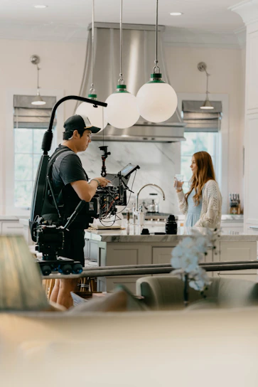 A vibrant behind-the-scenes shot of Karen Facchini directing a social media content shoot.