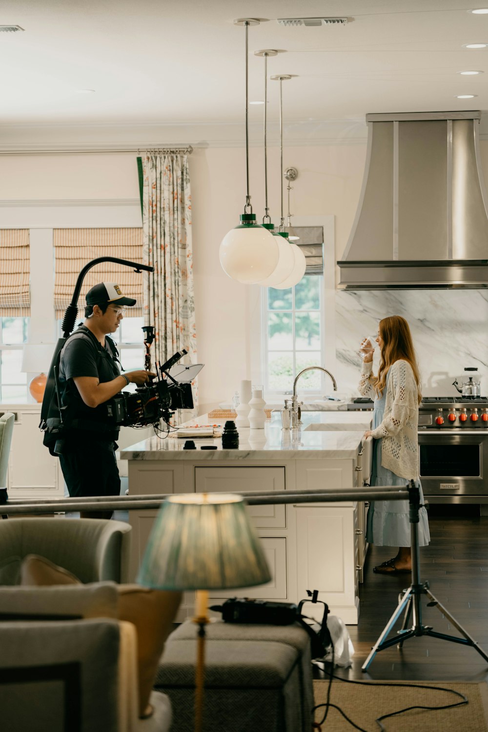 a man and a woman standing in a kitchen