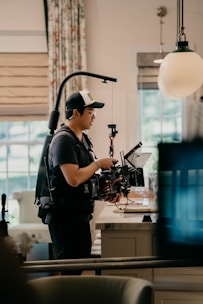 A professional photographer capturing a 360-degree image inside a modern office space.