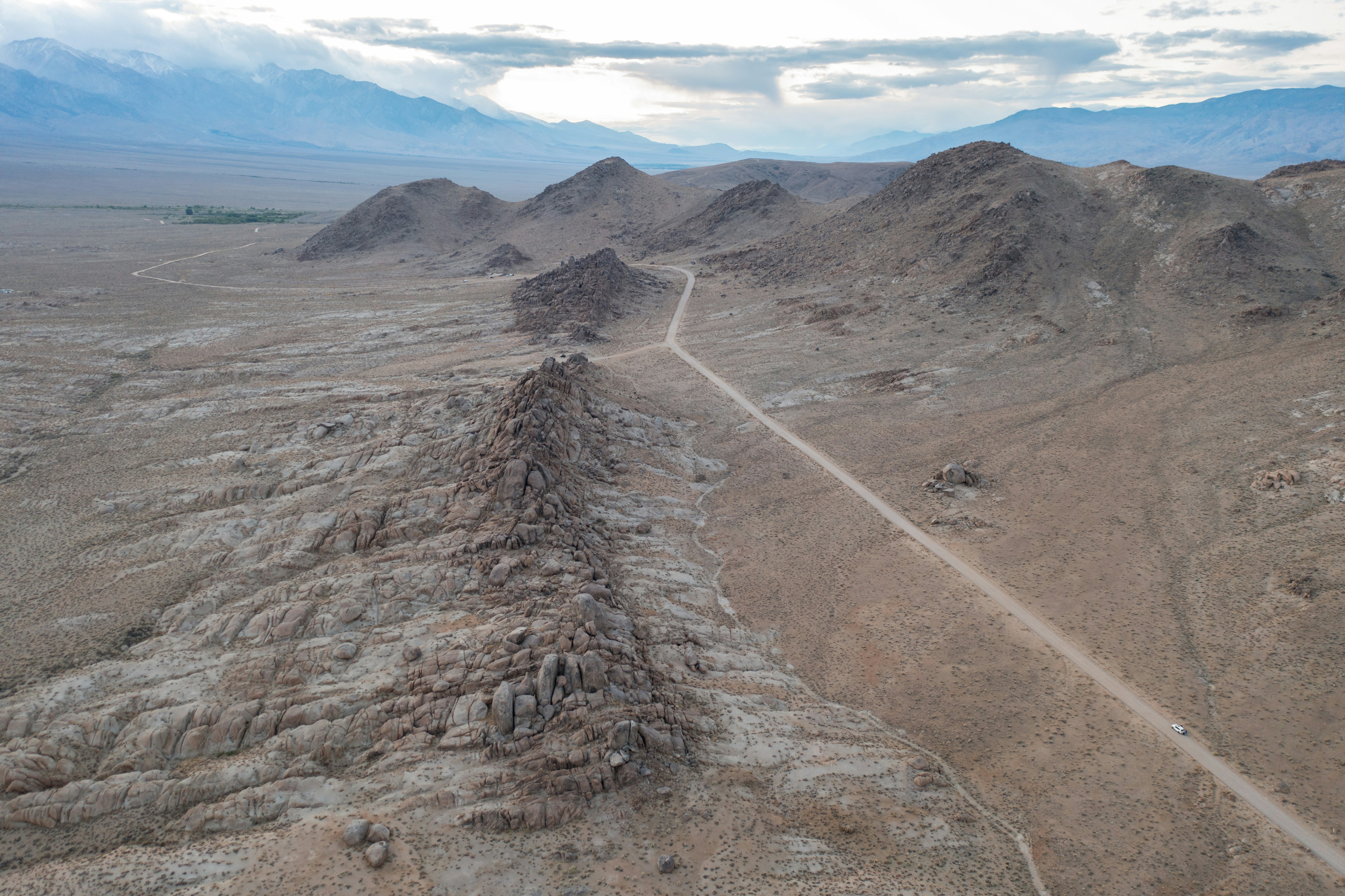 a dirt road in the middle of a desert