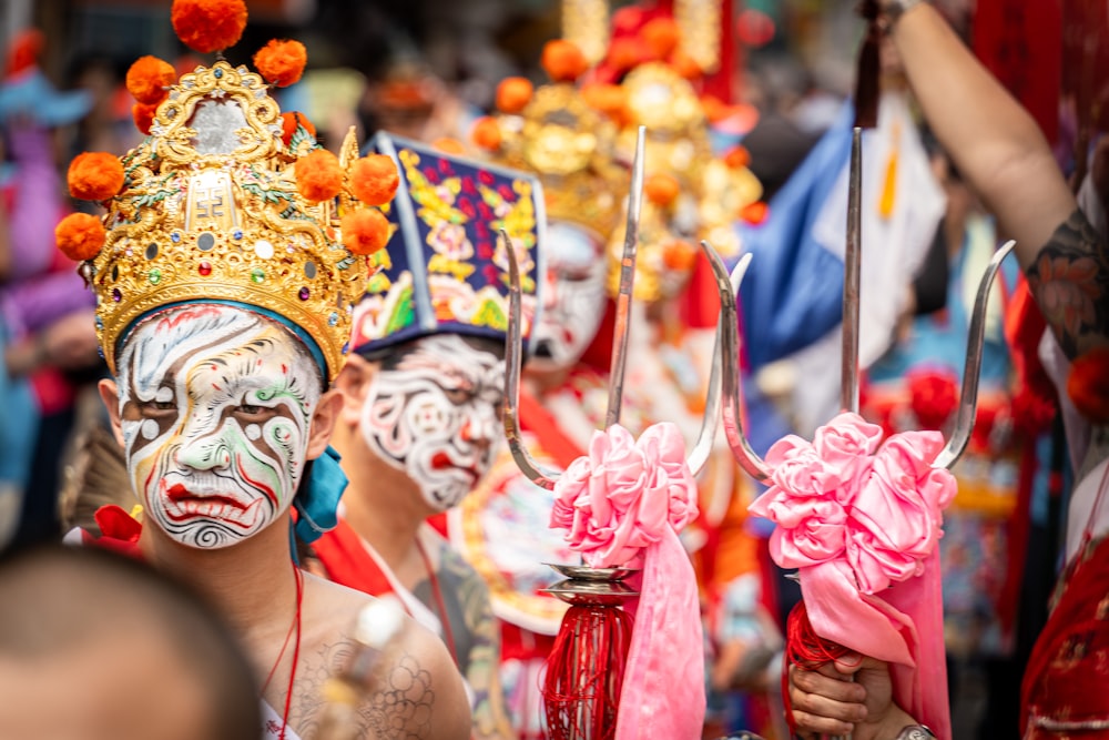 a group of people with painted faces and masks