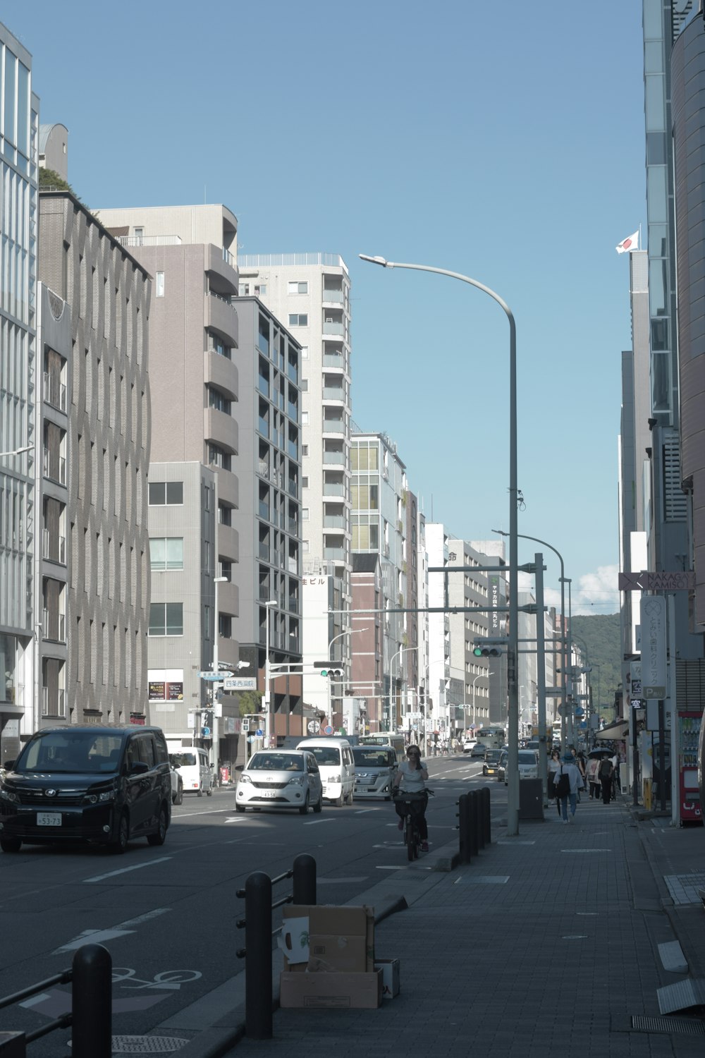 a city street filled with lots of tall buildings