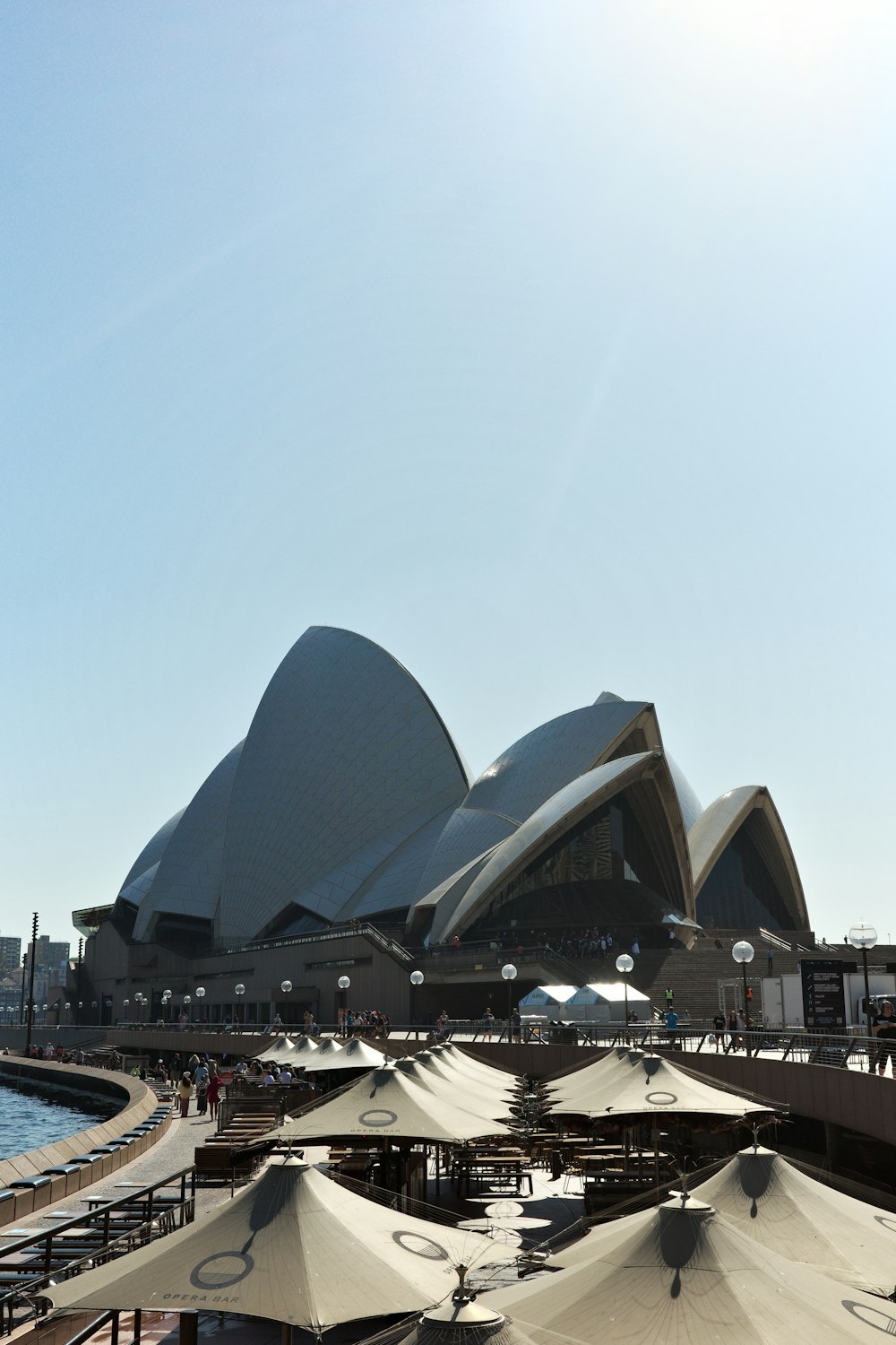 a large building with a lot of umbrellas in front of it