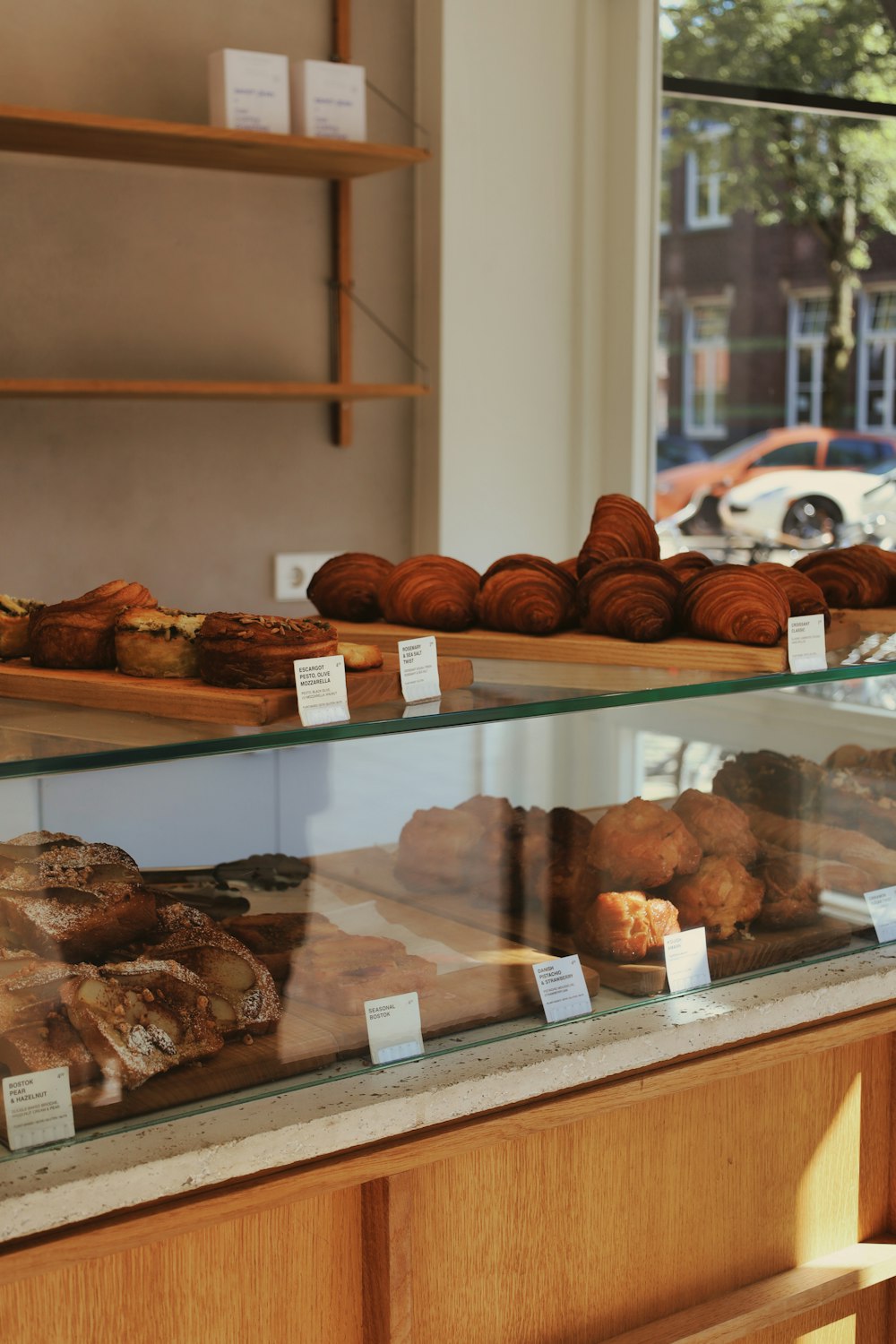 a display case filled with lots of different types of pastries