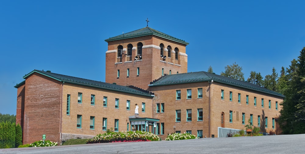 a large brick building with a clock tower