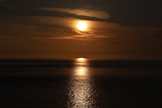 A vibrant sunset over a calm sea, reflecting the beauty of renewal.