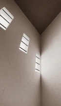 Minimalistic close-up of a clean, modern brick wall with soft natural light.