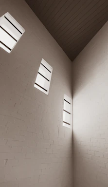 Minimalistic close-up of a clean, modern brick wall with soft natural light.