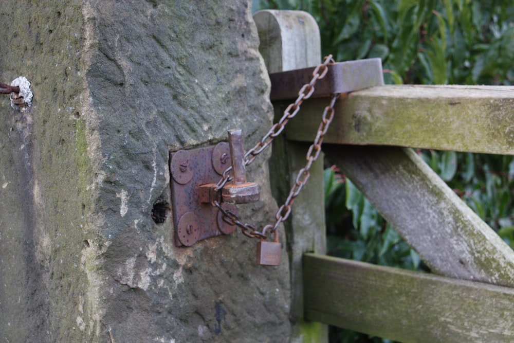 a close up of a lock on a stone wall