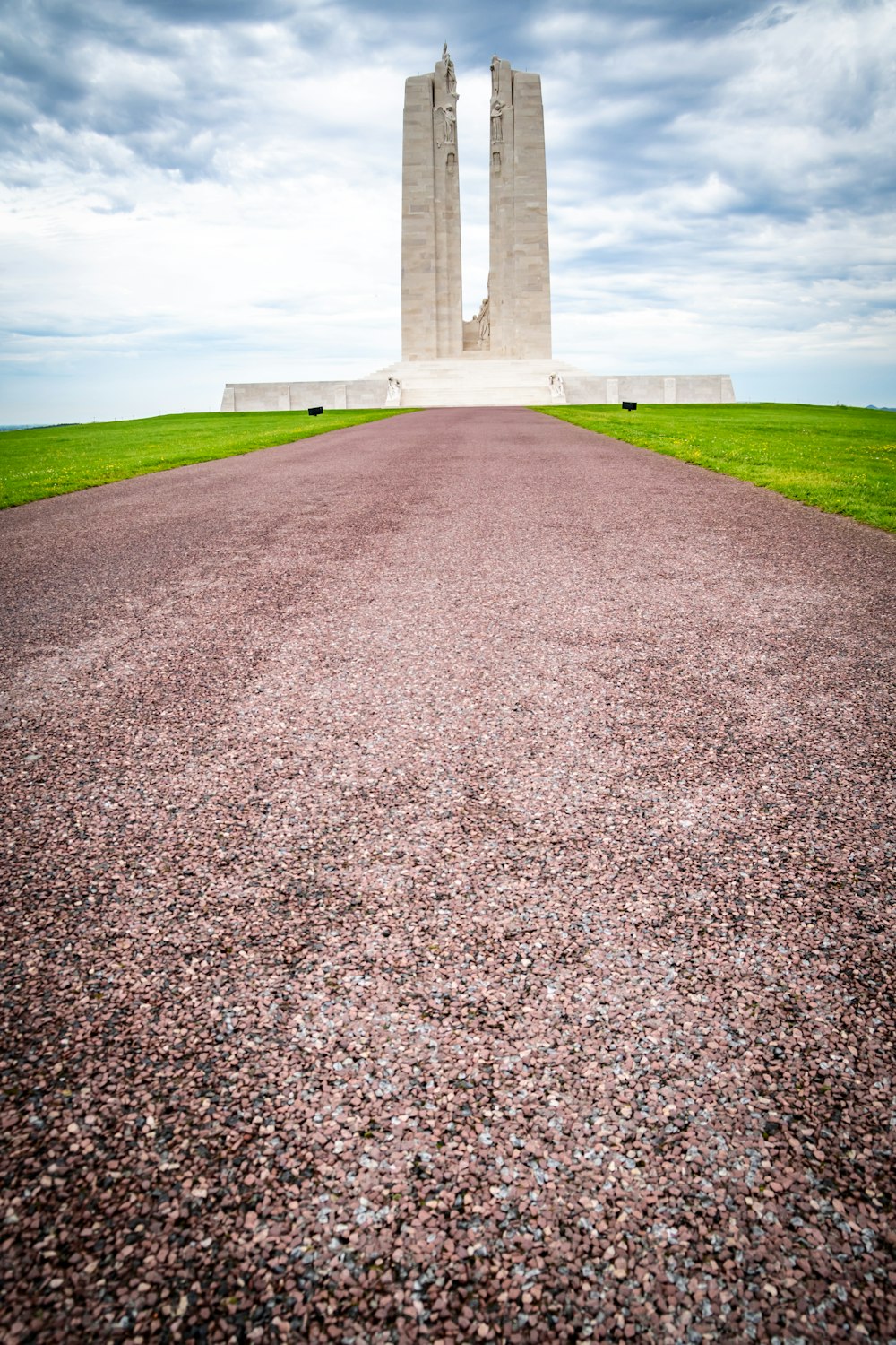 a large monument sitting on top of a lush green field