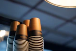 Close-up of elegant disposable cups stacked neatly with soft lighting highlighting their texture.