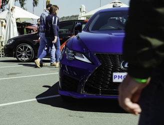 A vibrant purple-themed interface showing various car service listings and maps.