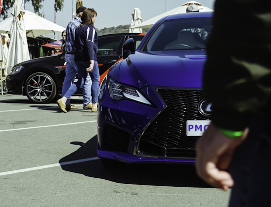 A vibrant purple-themed interface showing various car service listings and maps.