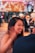 A smiling woman enjoying a wellness event.