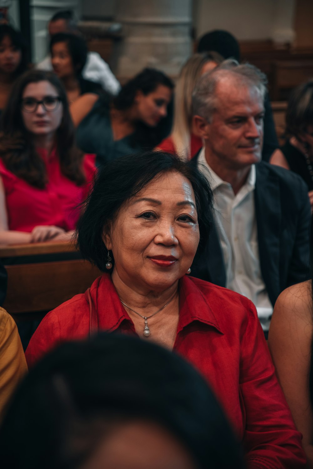 a group of people sitting next to each other