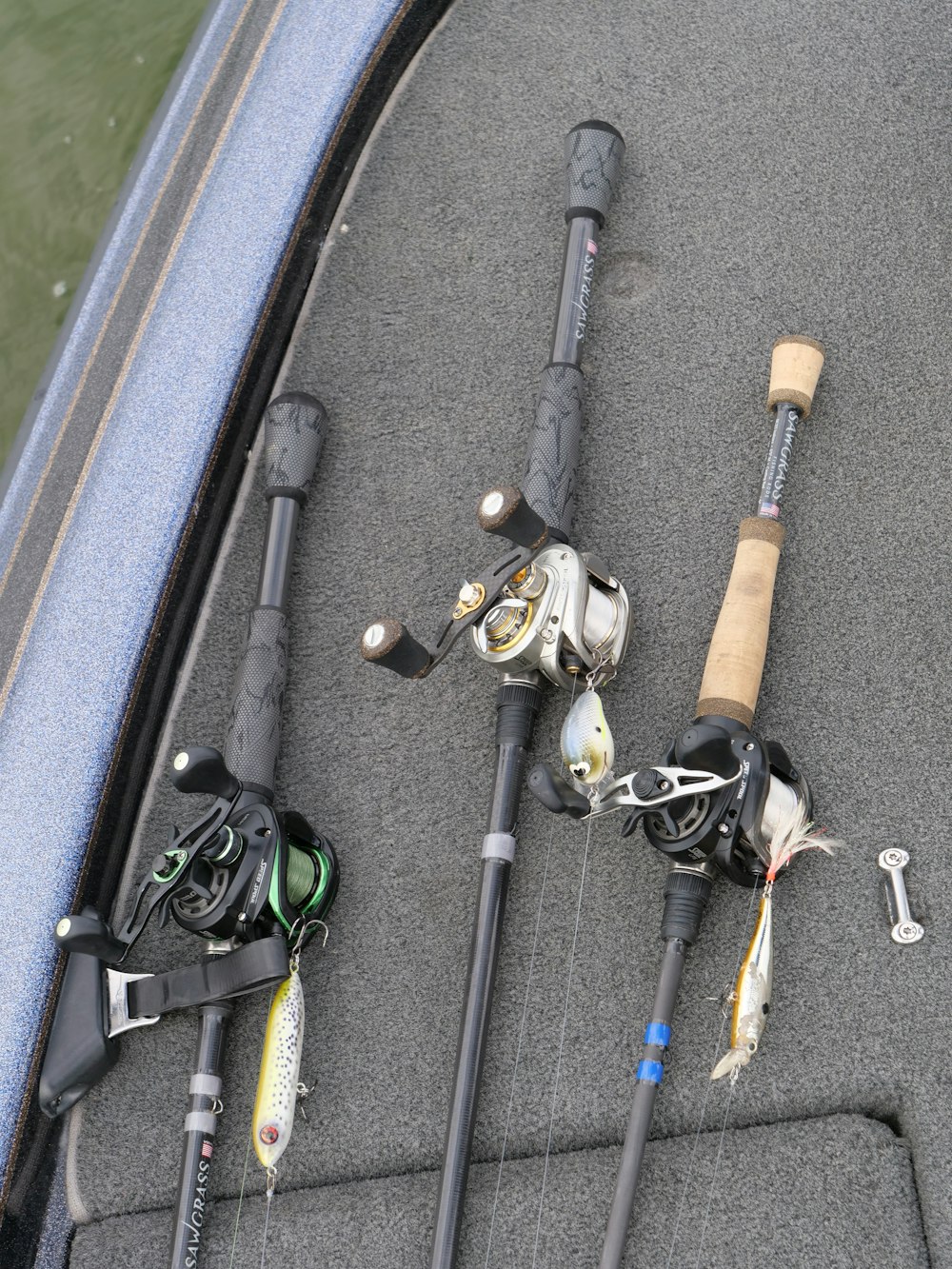 a couple of fishing rods sitting on top of a boat