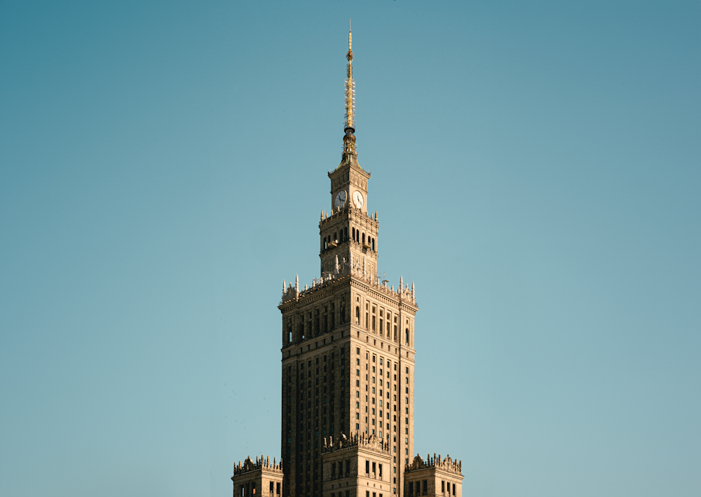 a tall building with a clock on the top of it