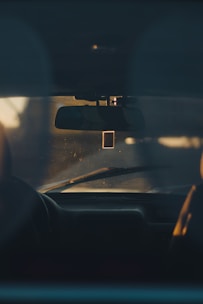 A comfortable backseat view inside a clean, spacious vehicle with soft lighting.