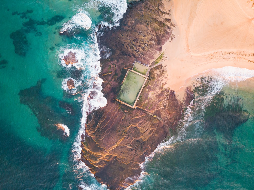 an aerial view of a beach and a body of water