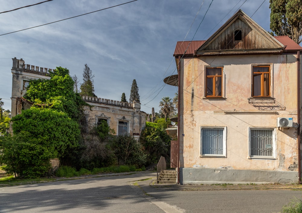 a run down house with a red roof