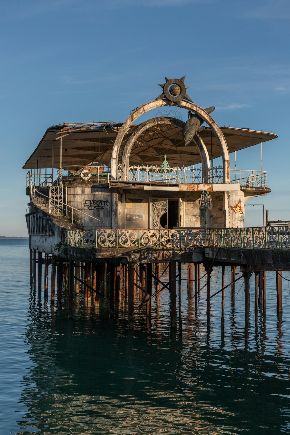 an old building sitting on top of a body of water