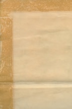 An aged, textured sheet of paper with visible folds and a bordered pattern. The paper has a yellowish-brown tint, indicating it is old or possibly stained.