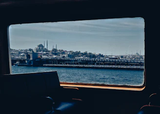A scenic view of Antalya coastline seen from inside a comfortable transfer vehicle window.