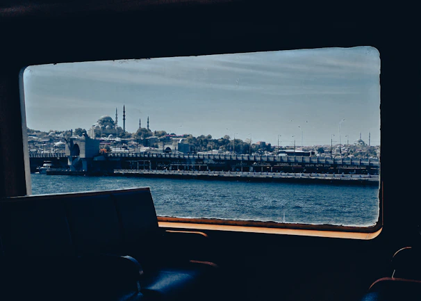 A scenic view of Antalya coastline seen from inside a comfortable transfer vehicle window.