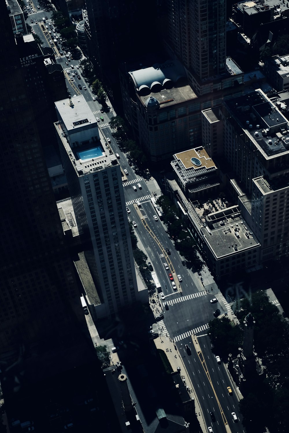 an aerial view of a city with tall buildings