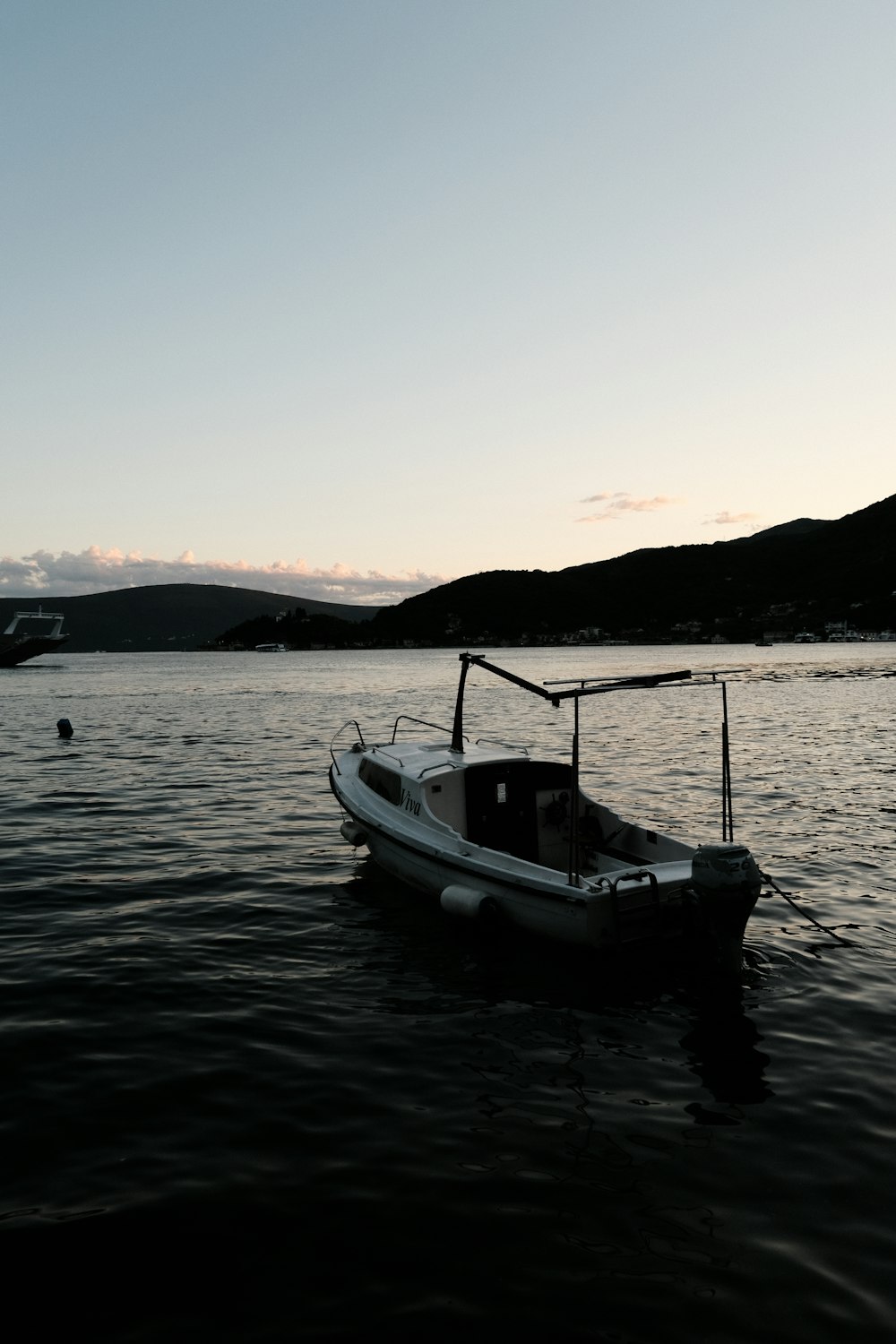 a boat floating on top of a body of water