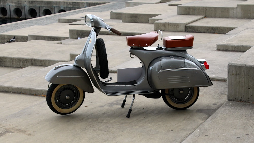 a motor scooter parked in front of steps