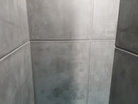 Industrial space featuring durable grey epoxy flooring with a smooth matte finish.