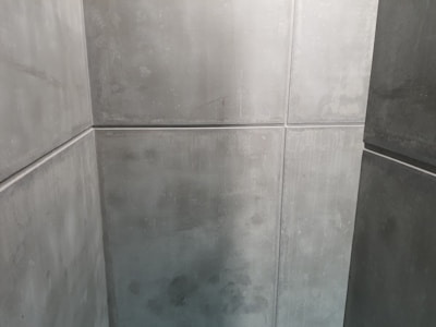 Minimalist concrete decor items on a neutral background.