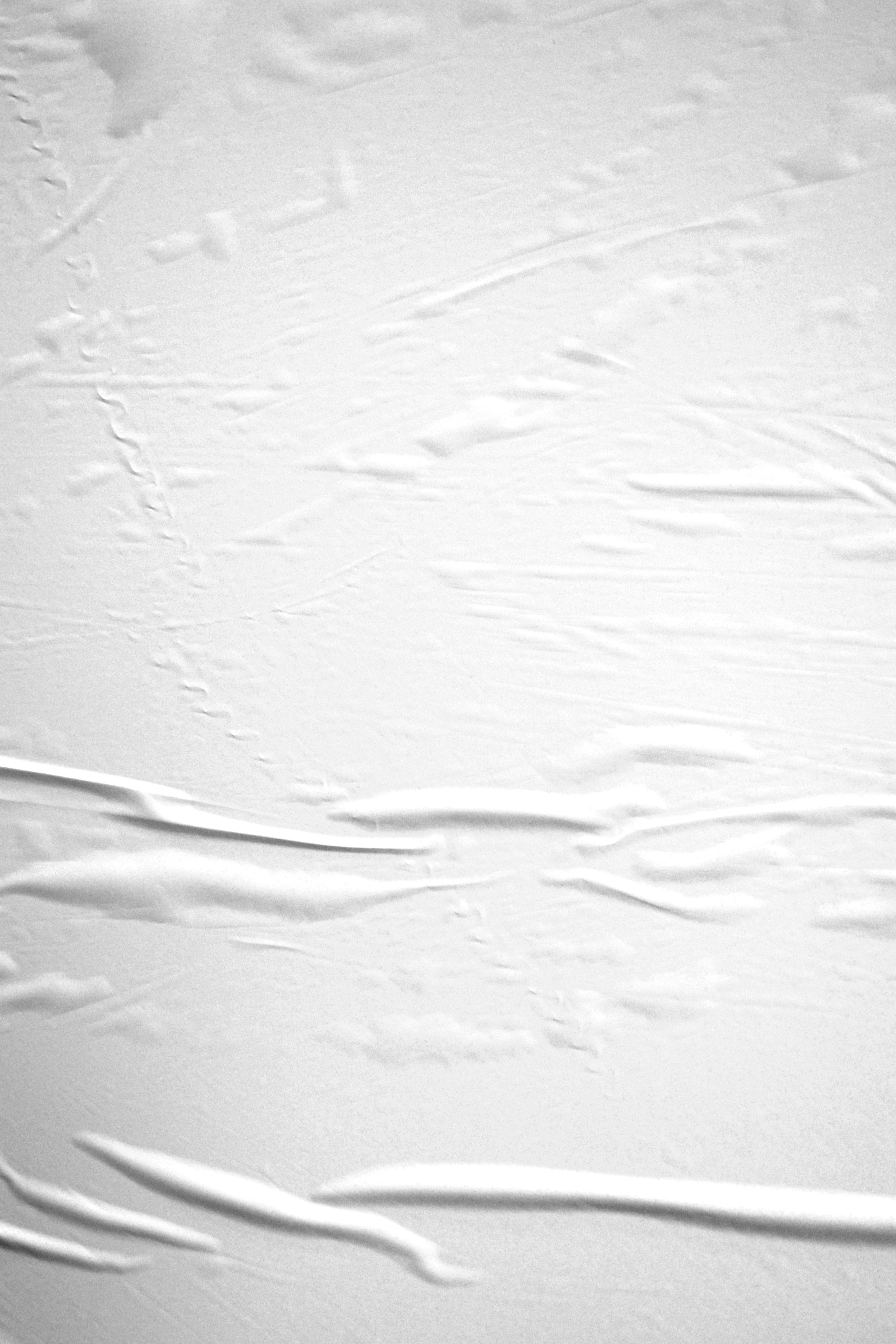 a snowboarder is going down a snowy hill