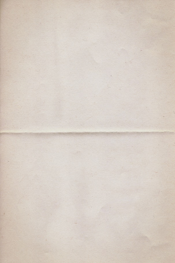 a piece of white paper with a brown border