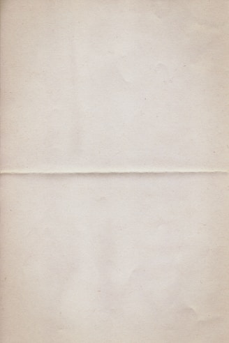 a piece of white paper with a brown border