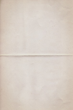 a piece of white paper with a brown border