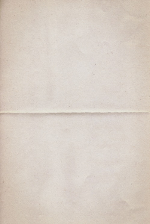 a piece of white paper with a brown border