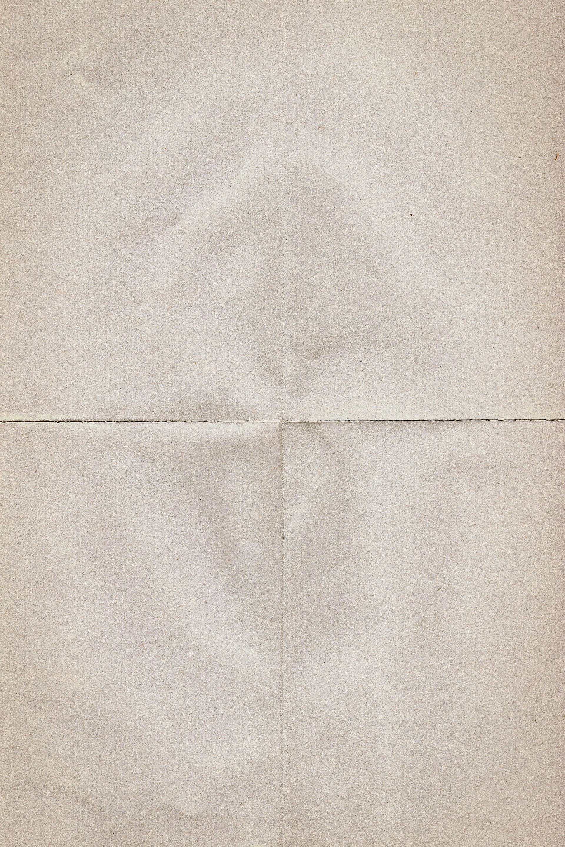 a piece of white paper with a cross on it