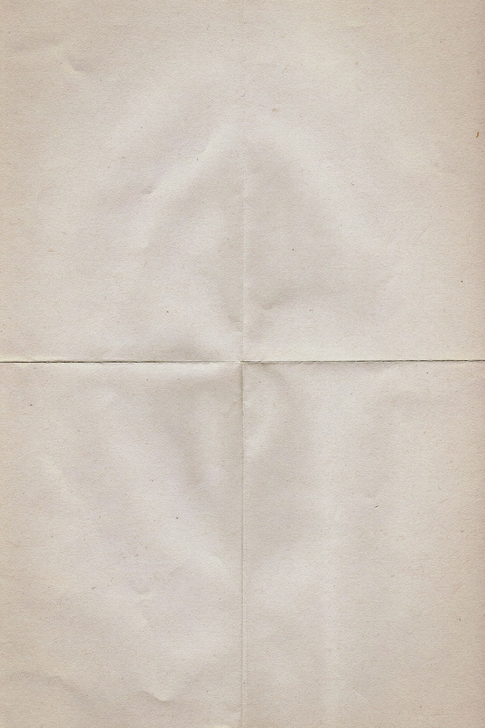 a piece of white paper with a cross on it