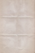 A textured sheet of paper with visible fold lines creating sections, giving it a vintage or aged look.