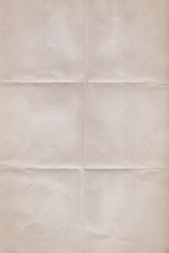 A textured sheet of paper with visible fold lines creating sections, giving it a vintage or aged look.