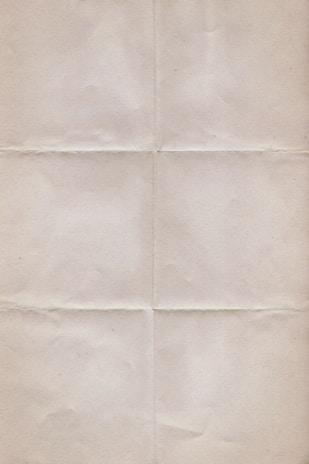 a piece of white paper with a black cat on it