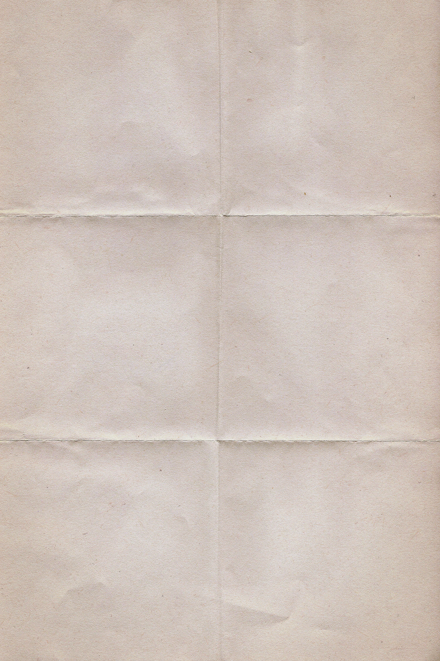 A sheet of folded, creased off-white paper filling the frame