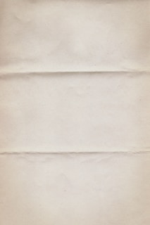 a piece of white paper with a brown border