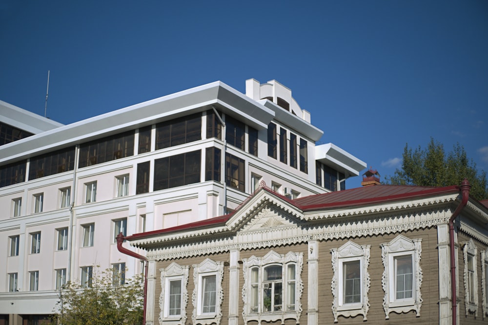 a large white building with a red roof