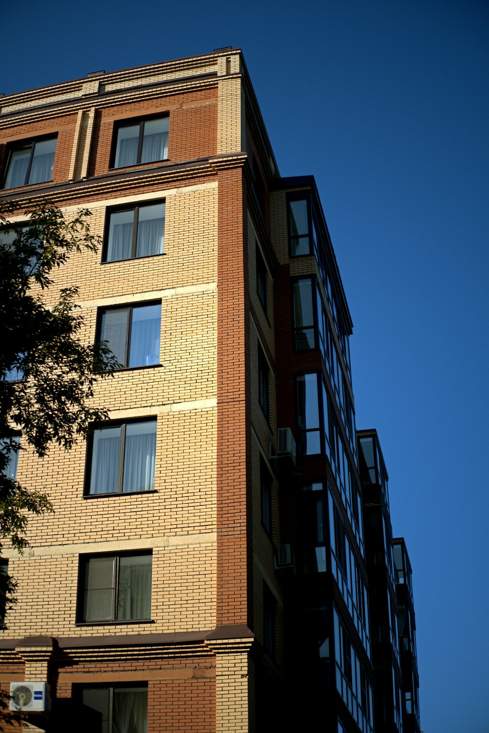 a tall brick building with lots of windows