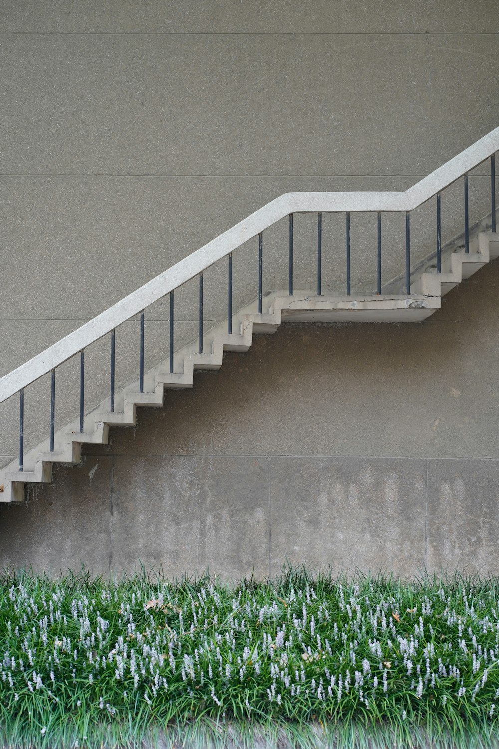 a fire hydrant sitting next to a set of stairs