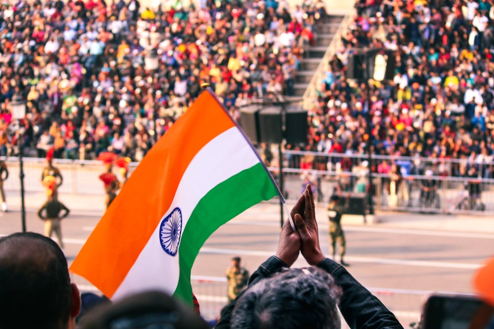 a large crowd of people watching a parade