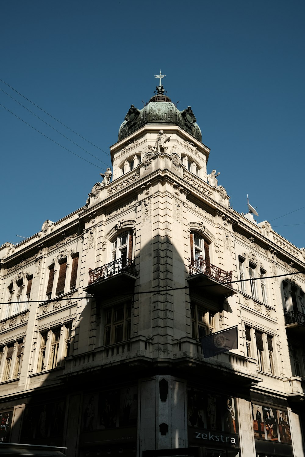 a tall building with a cross on top of it